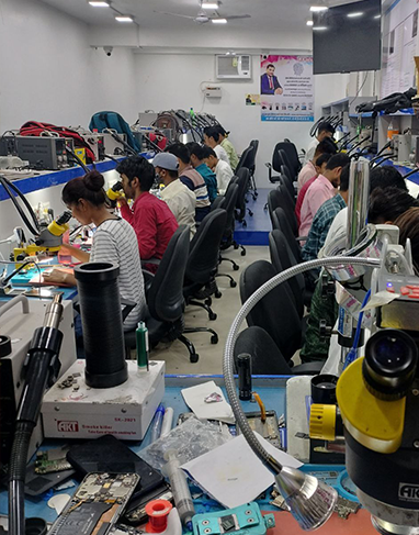 Hands-on training session in mobile repair workshop